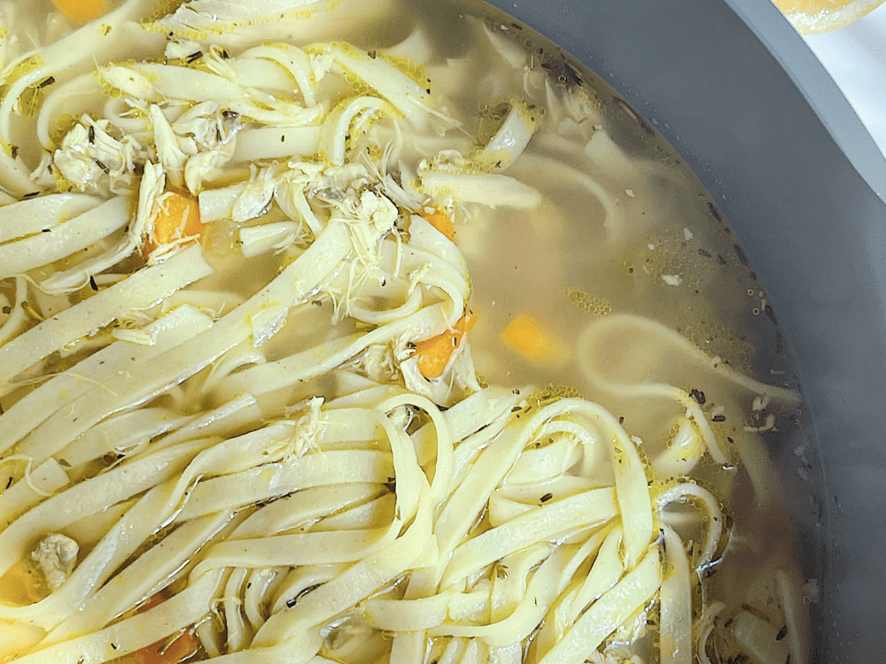 chicken noodle soup in a pot without a ladle